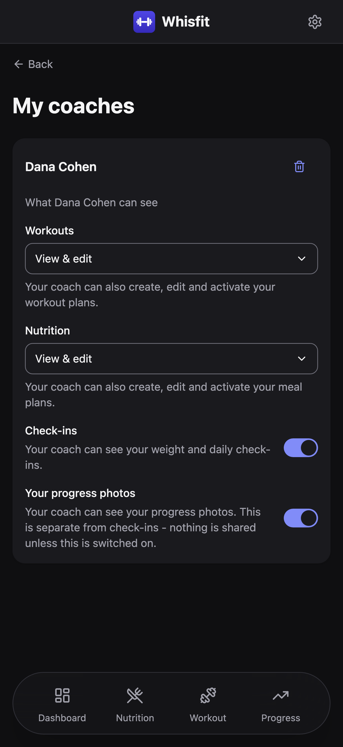 The My coaches settings page, seen from a trainee's account: a Whisfit Coach entry with Workouts and Nutrition dropdowns set to View & edit, and Check-ins and Your progress photos toggles both switched on.